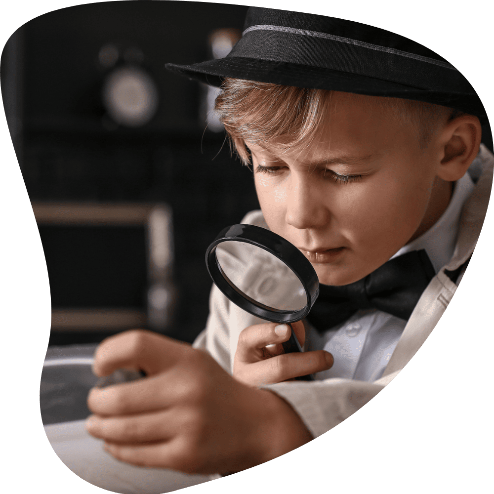 detective kid holding magnifying glass